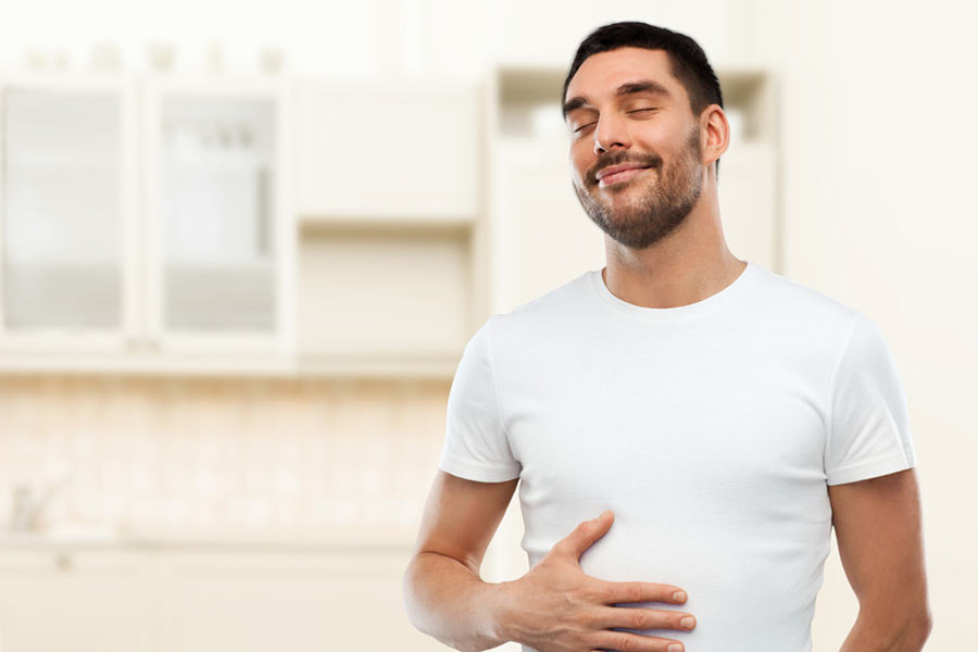 man with a happy tummy | autoimmune conditions and digestive issues | Dr. Negin Misaghi, ND